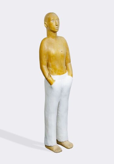 A Figure wearing white pants
