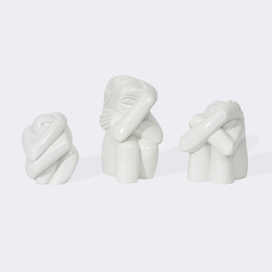 Drei hockende Kreaturen