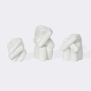 Drei hockende Kreaturen