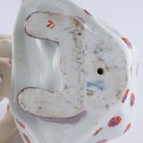 Hockendes Kind mit einer Puppe - Bild 4