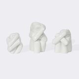 Drei hockende Kreaturen