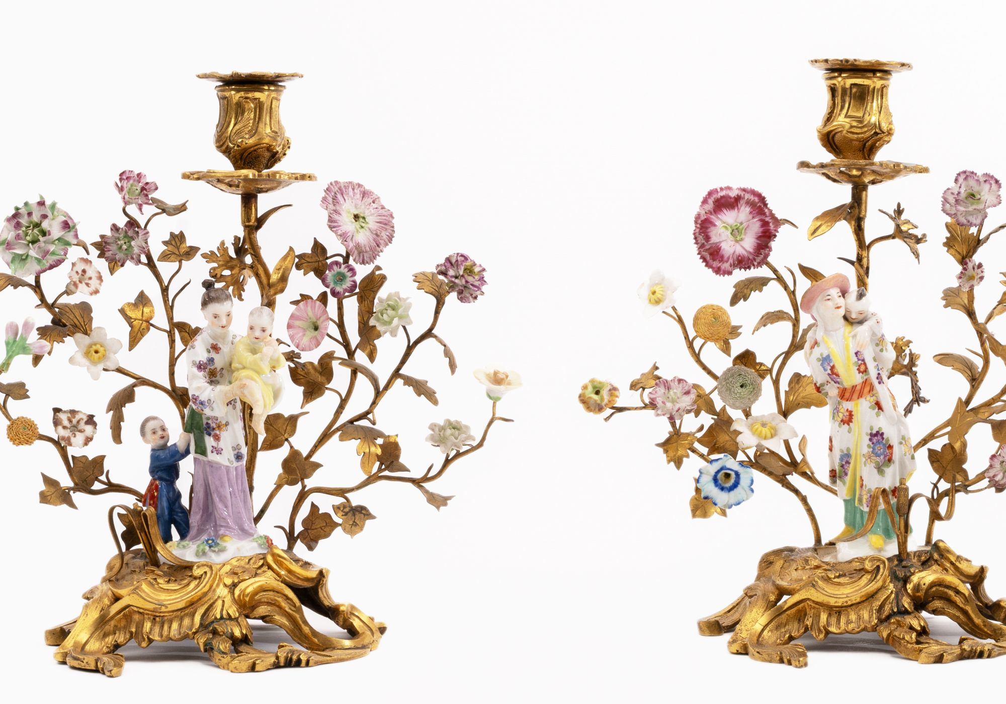 Pair of Meissen Chinese boys with cabbage leaf hats as candlesticks in ormolu mount